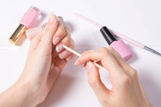 Push back the cuticle with a wooden stick