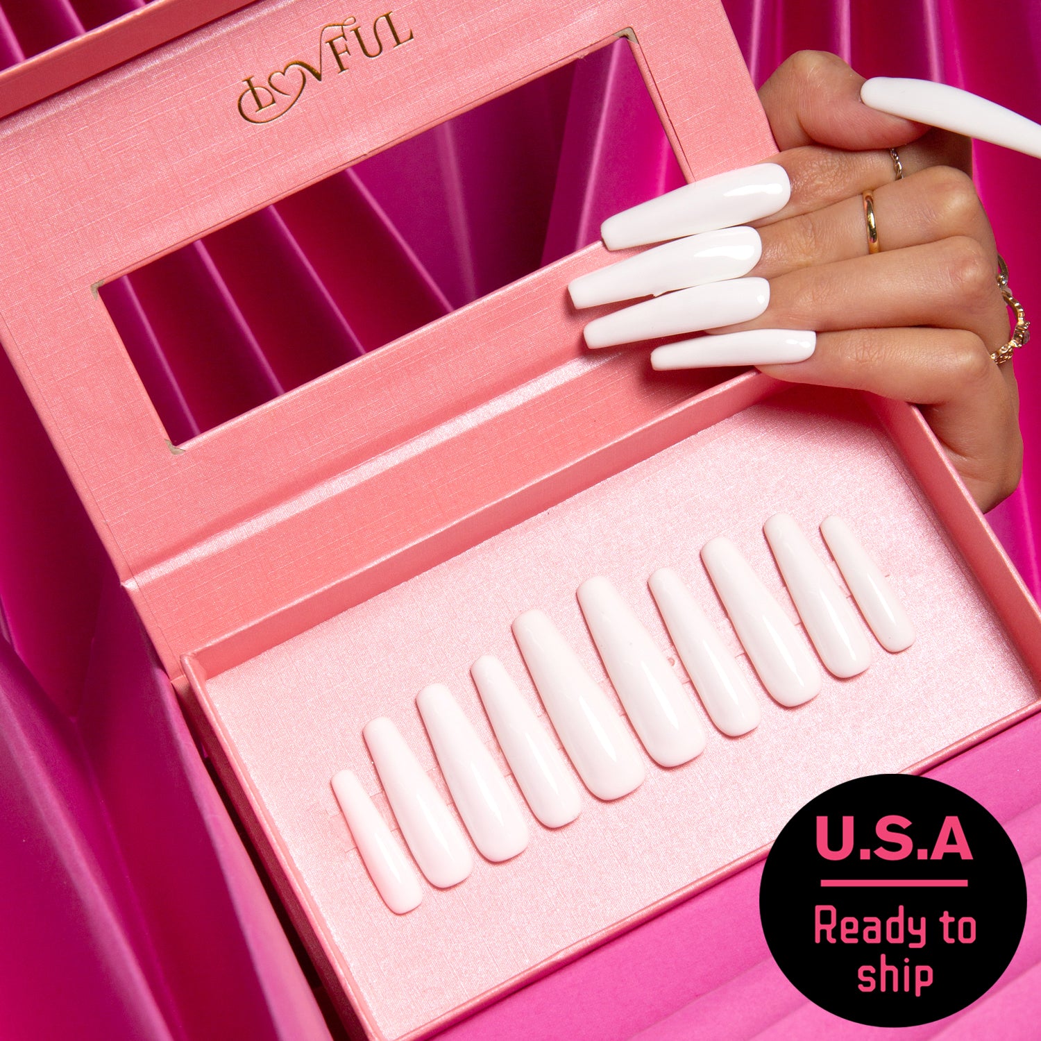 Set of Lovful long, white coffin-shaped press-on nails in a pink box with a hand wearing matching nails. Text on a sticker reads 'U.S.A Ready to ship'.