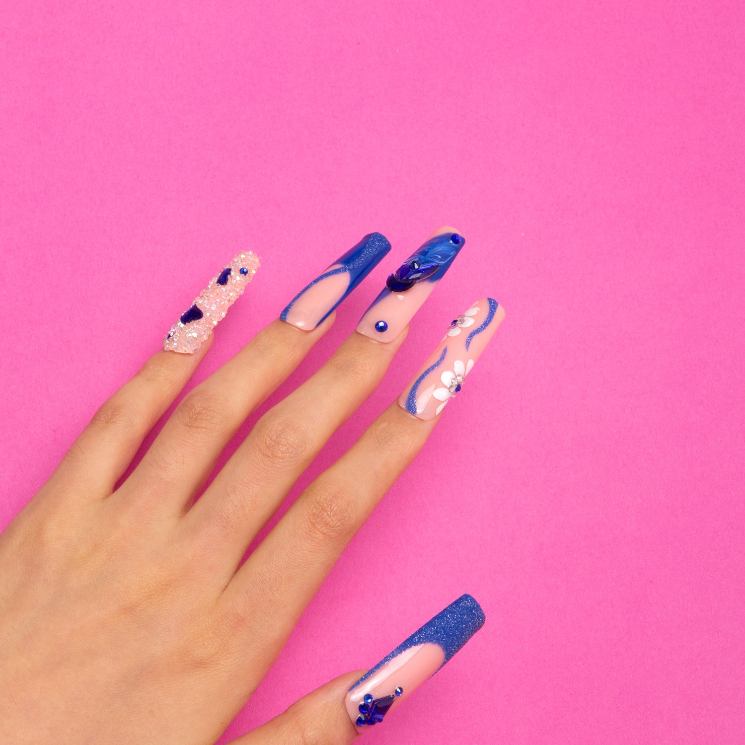 Glimmer Fuse nails, blue French tip with gems and floral