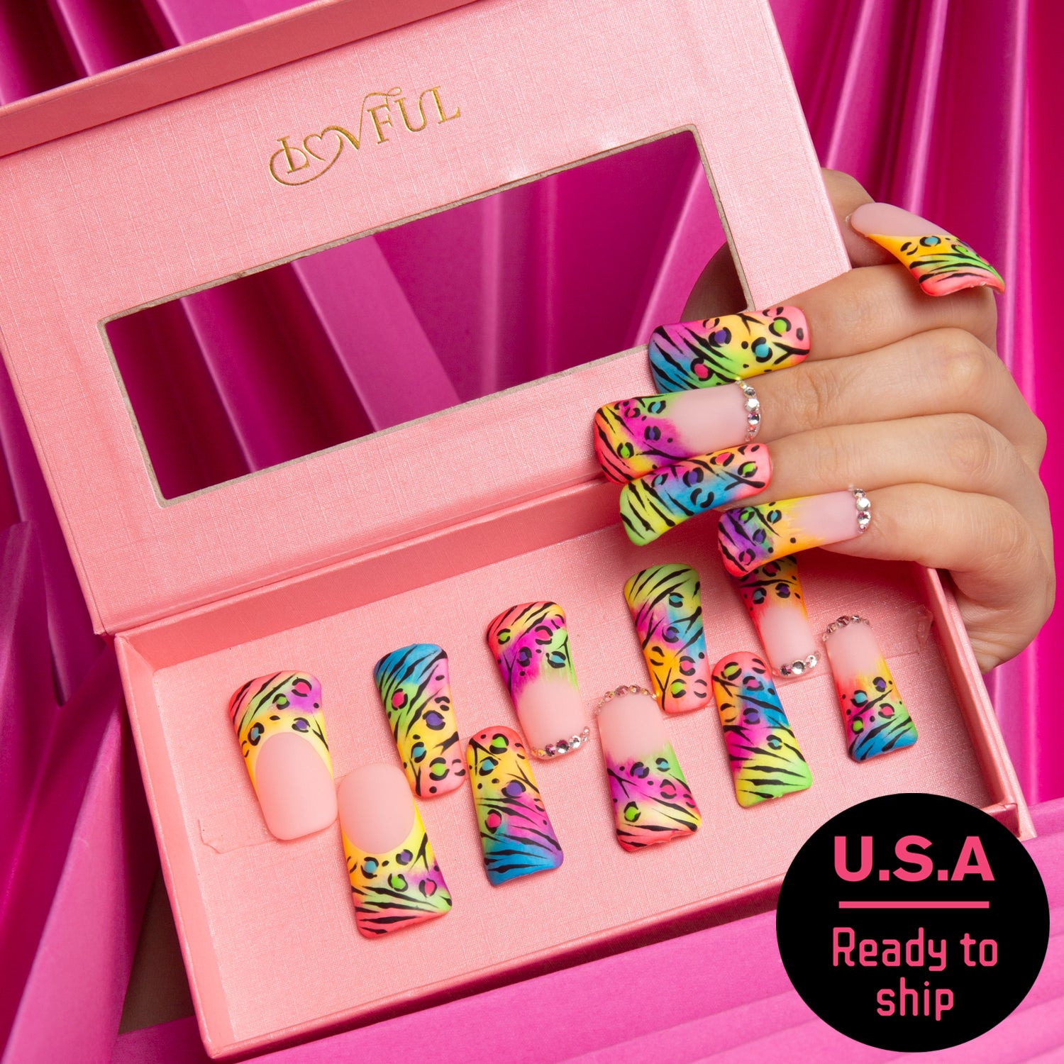 Lovful press-on acrylic nails with colorful bright French tips and leopard prints, ready to ship from the U.S.A. The nails are displayed in a pink box with a clear window, perfectly arranged inside.