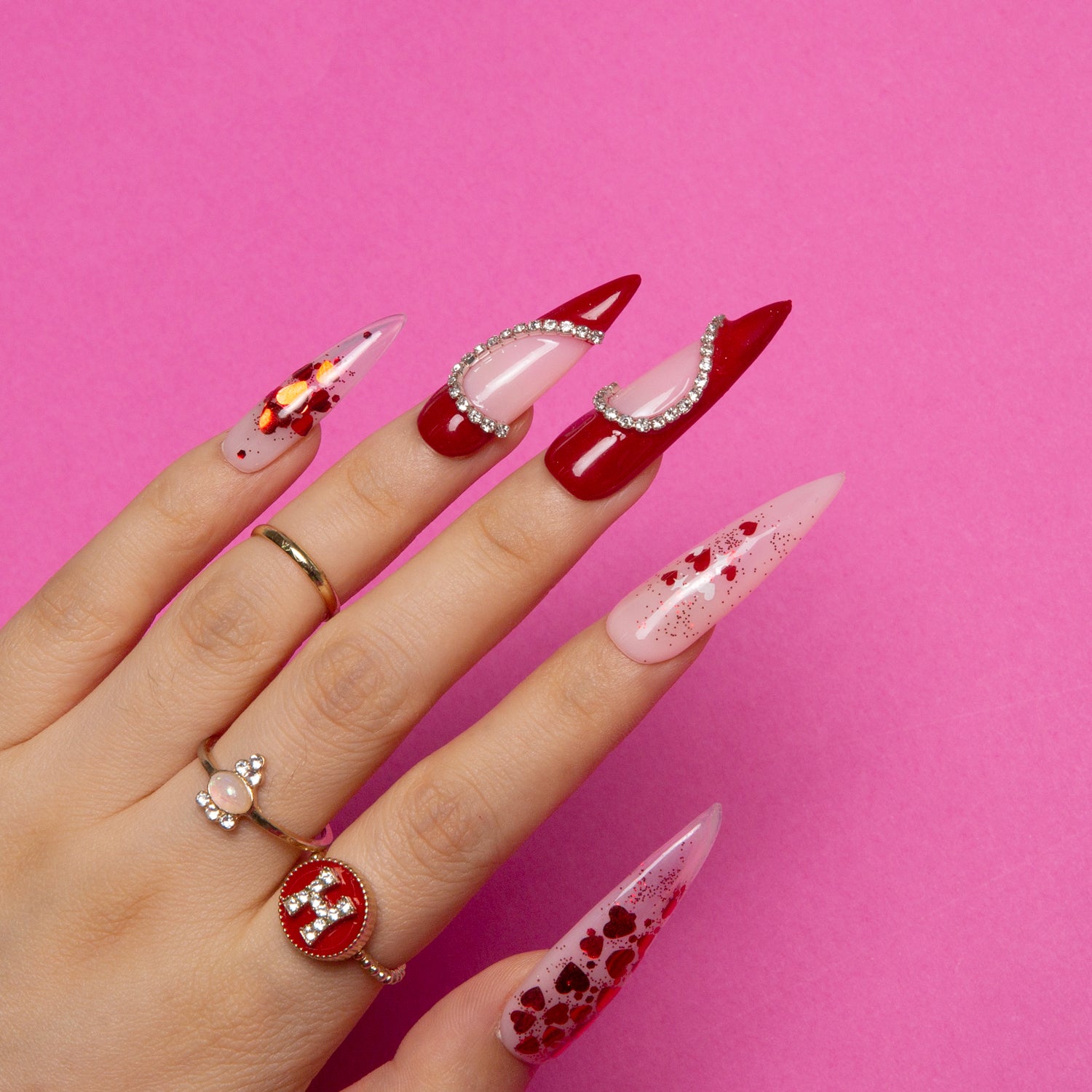 Valentine's Day stiletto nails with rhinestones and hearts