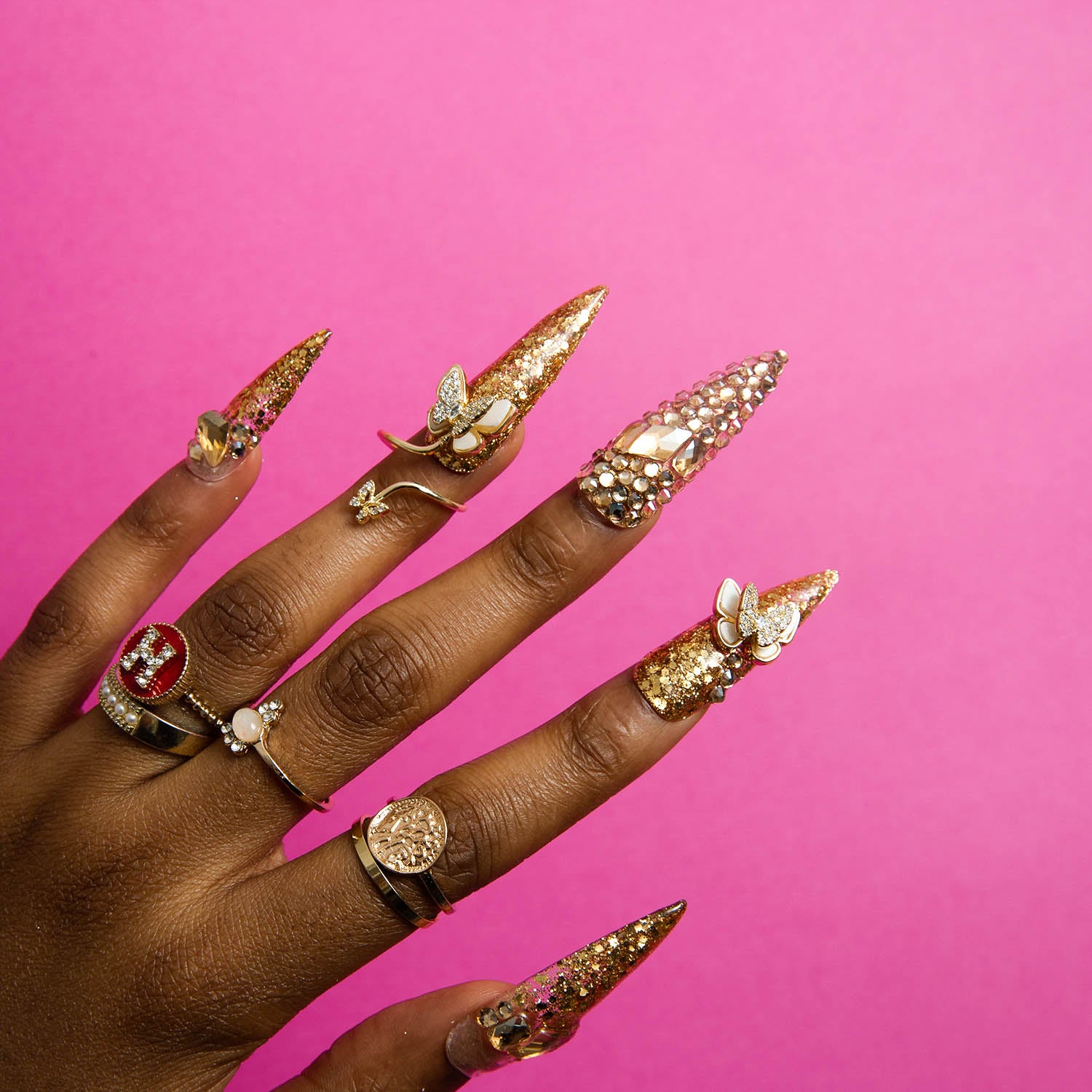 Gold glitter stiletto press on nails with butterfly and rhinestones