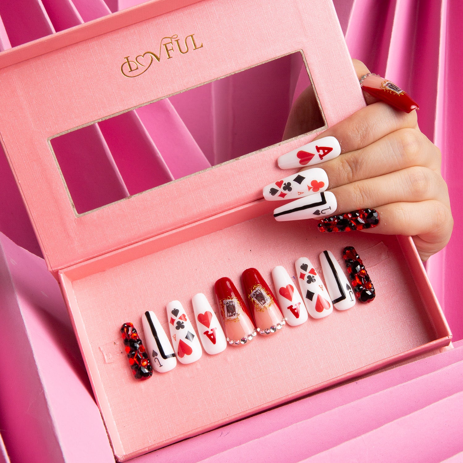 Poker Queen press-on acrylic nails in a pink box, featuring red and white playing card designs with hearts, spades, and intricate details inspired by Alice in Wonderland, perfect for high-stakes poker players.