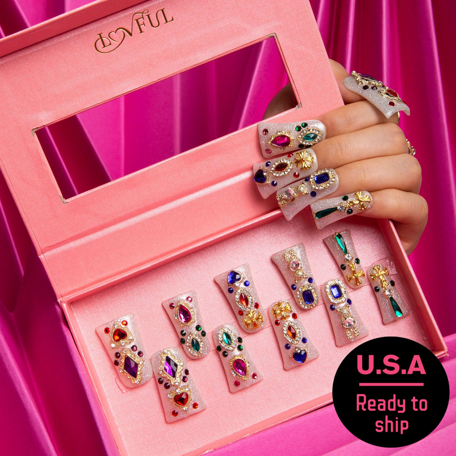 Lovful's Treasure Trove press-on nails adorned with colorful gems and glitter in a pink box. Ready to ship in the USA.