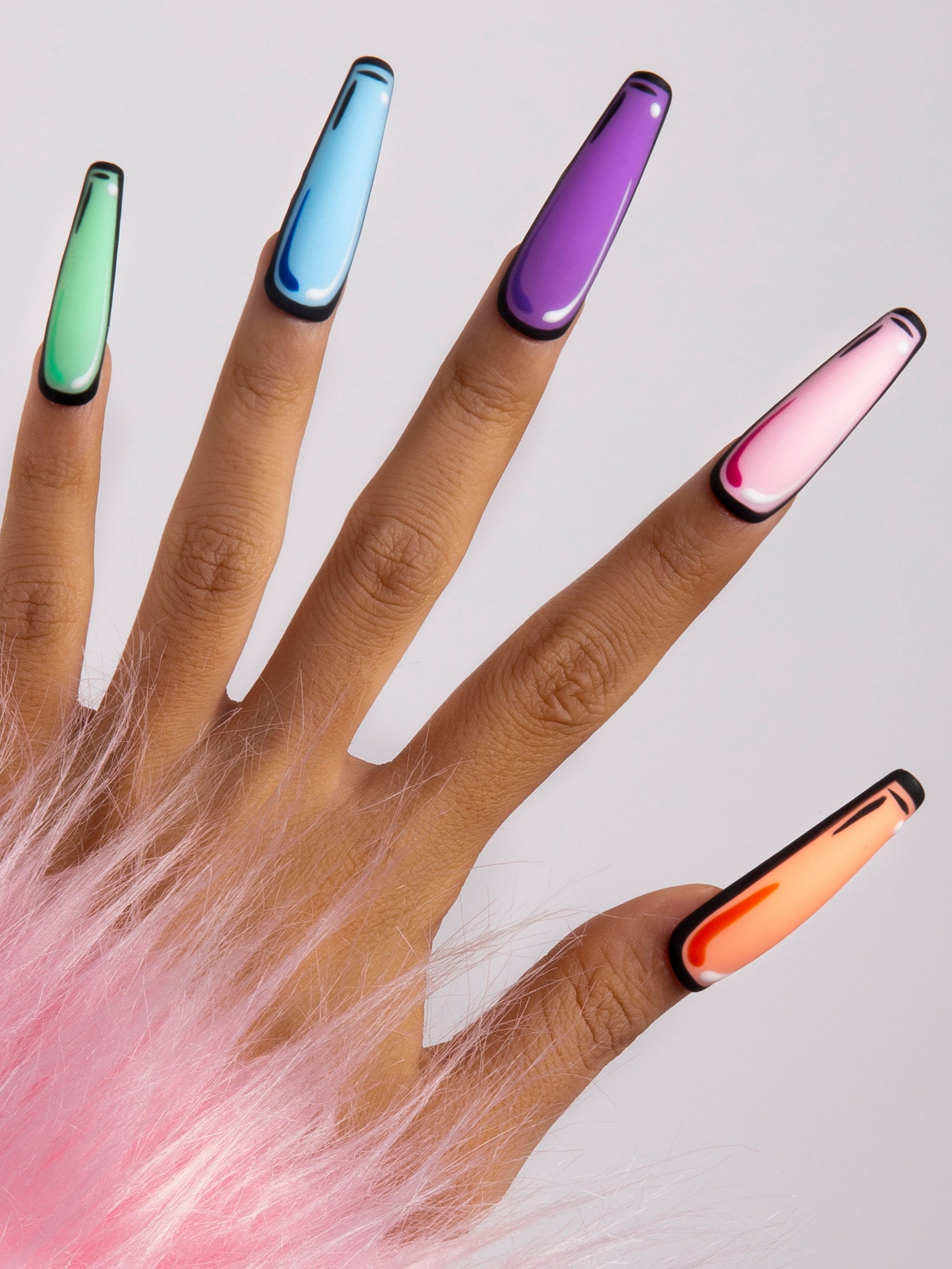 Hand displaying Lovful's 'Colorful Pop' press-on acrylic nails set, featuring a vibrant pop art design in green, blue, purple, pink, and orange with black outlines and a glossy finish.