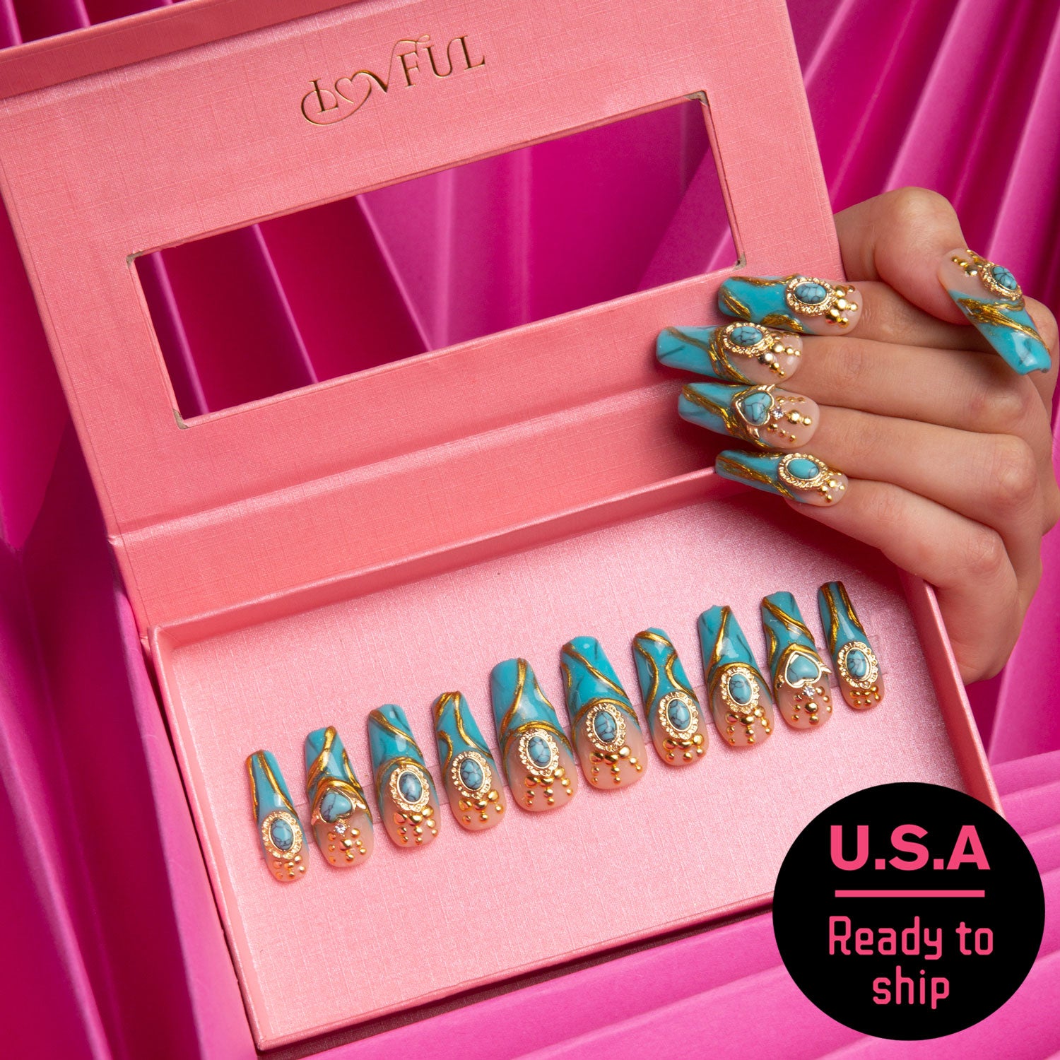 Box of luxurious press-on acrylic nails with turquoise and gold decor, held by a hand with matching nails. Lovful branding and 'USA Ready to ship' badge. Pink background.