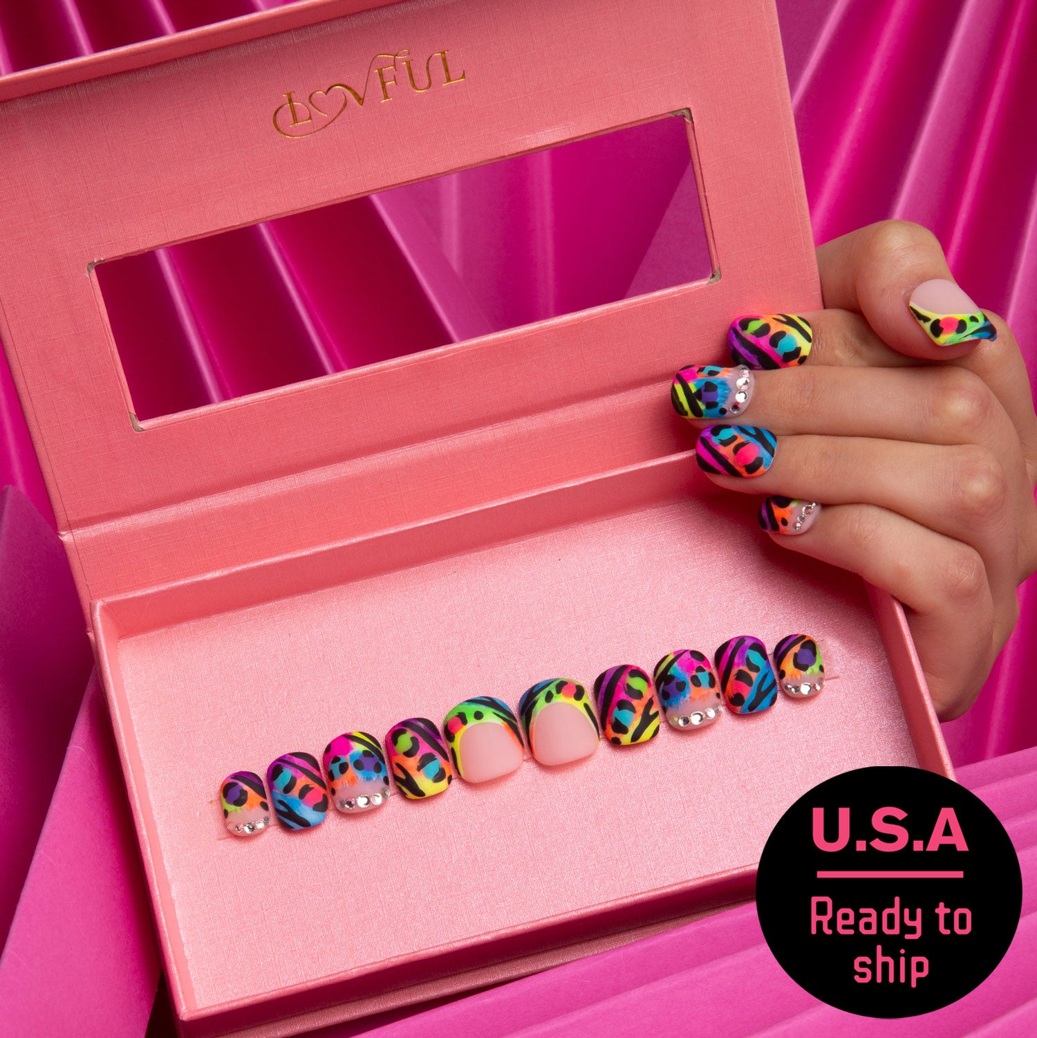 Colorful press-on nails with leopard prints by Lovful in a pink box, vibrant designs suitable for a playful and confident look, Ready to Ship U.S.A.