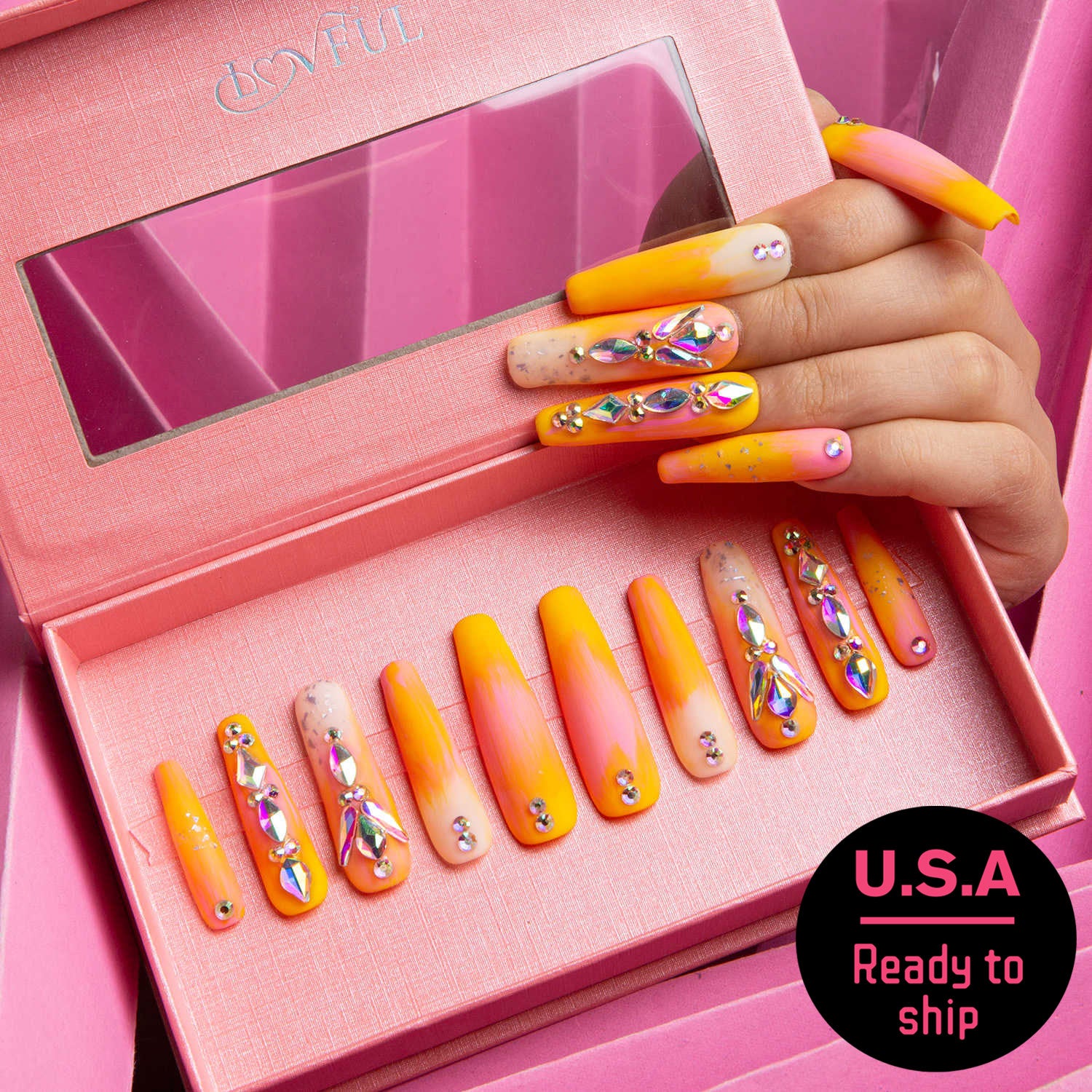 Lovful's 'Sunset Slushy' coffin-shaped press-on nails in a display box, blending orange and yellow tones with rhinestone decorations, USA ready to ship.