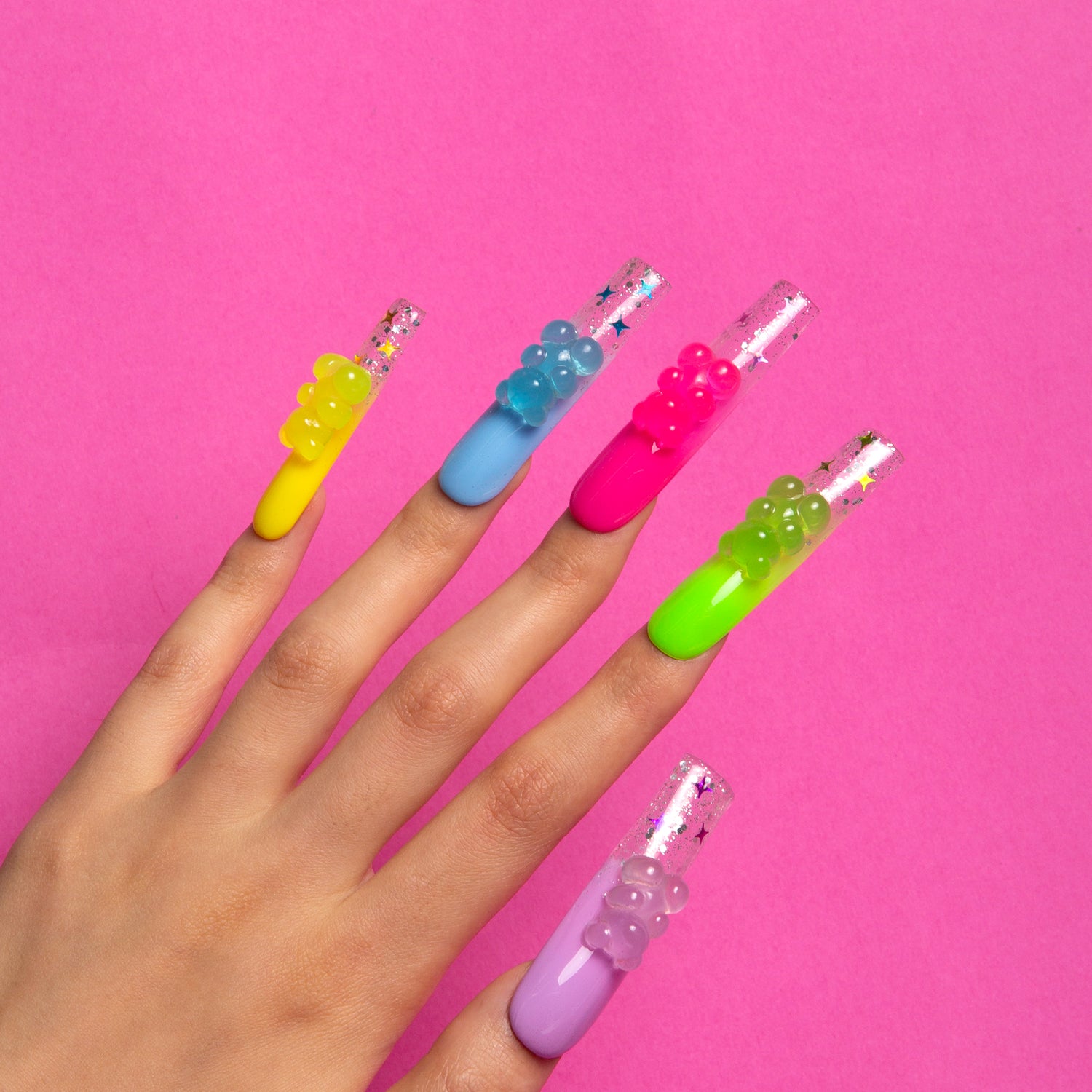 Sweet Wonderland press-on nails. Each nail is a different color, from candy pink to sunshine yellow. Fun and personality.