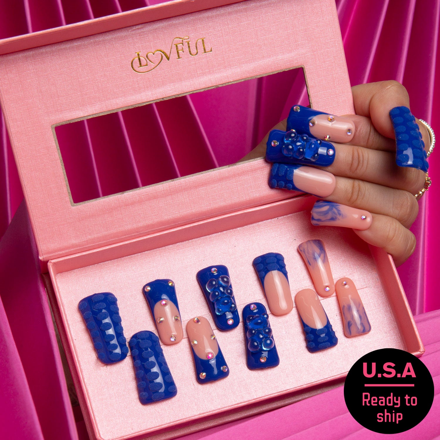 Lovful Little Blue Bear press-on nails set in a pink velvet box, featuring blue French tips with rhinestones and gummy bear designs, ready to ship in the U.S.A.