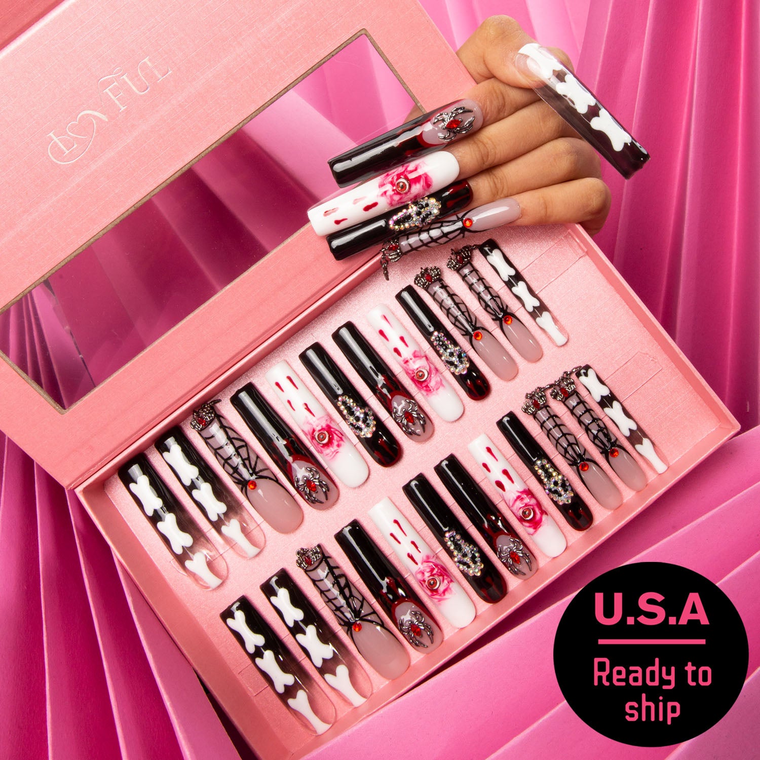 24 pcs Final Destination press-on nails set in a pink box, featuring macabre designs with eyes, ghosts, and bone patterns in red, black, and white hues. A hand model showcasing several nails. U.S.A Ready to ship.