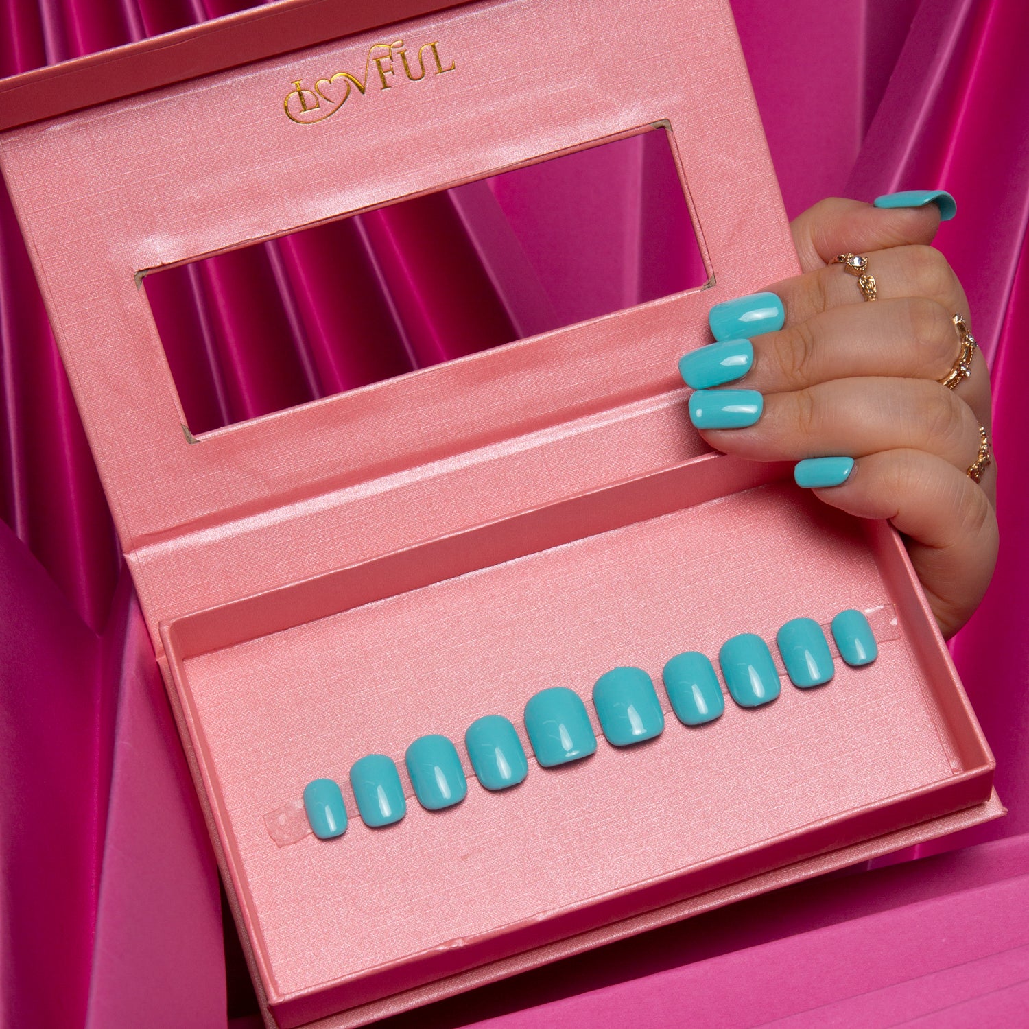 Shiny Blue press-on acrylic nails in a pink box with the Lovful logo, against a pink background.