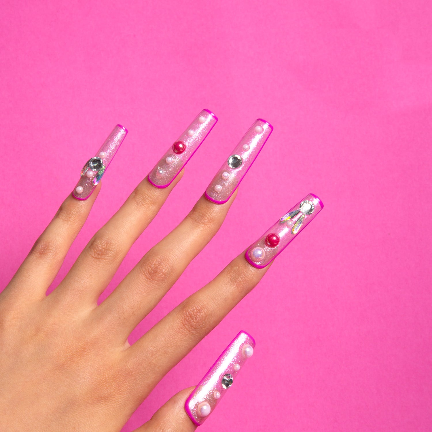 After School Press-On Nails for Barbie Lovers. Each nail is outlined in pink and filled with sparkles.
