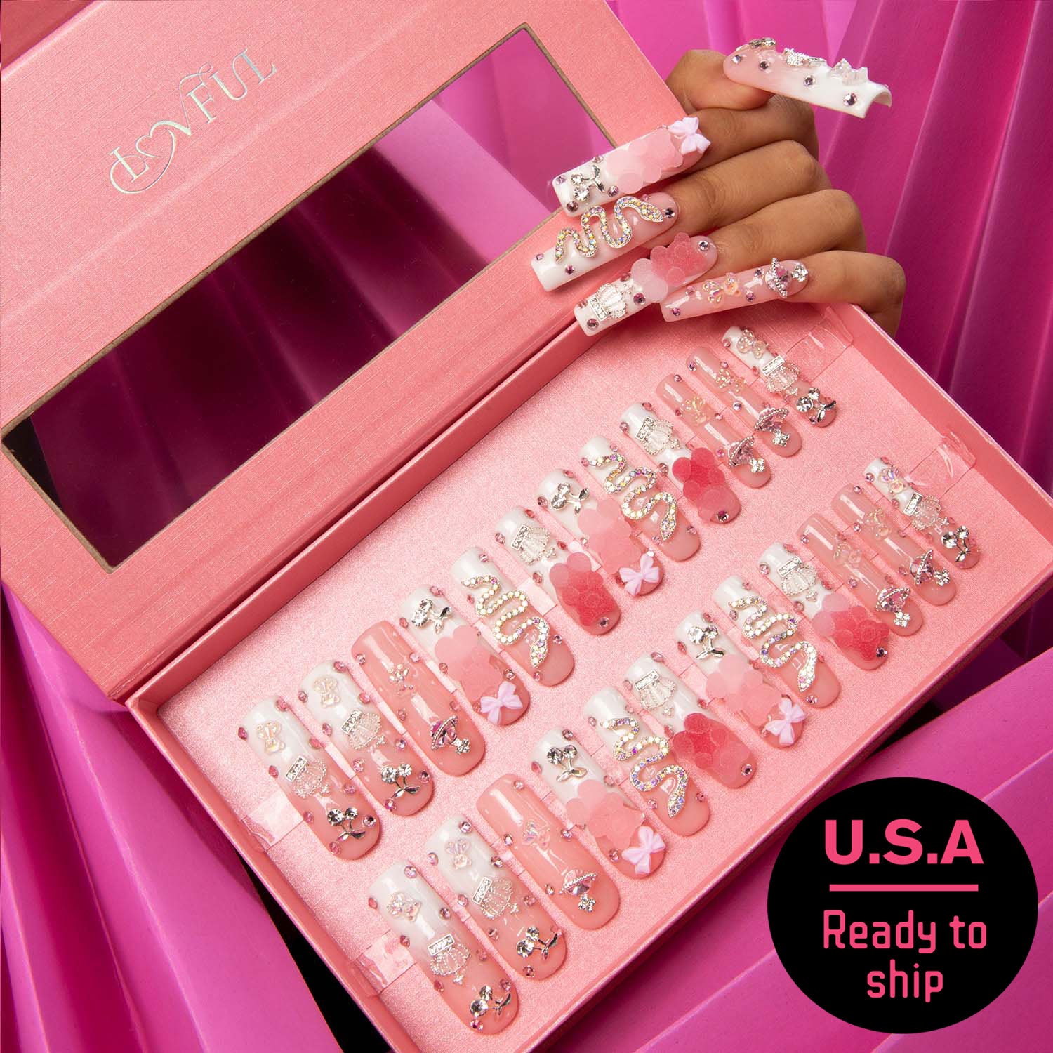 24 pink French tip press-on nails with gummy bear decor in a pink Lovful box, featuring a hand displaying the nail design. U.S.A. Ready to ship label.