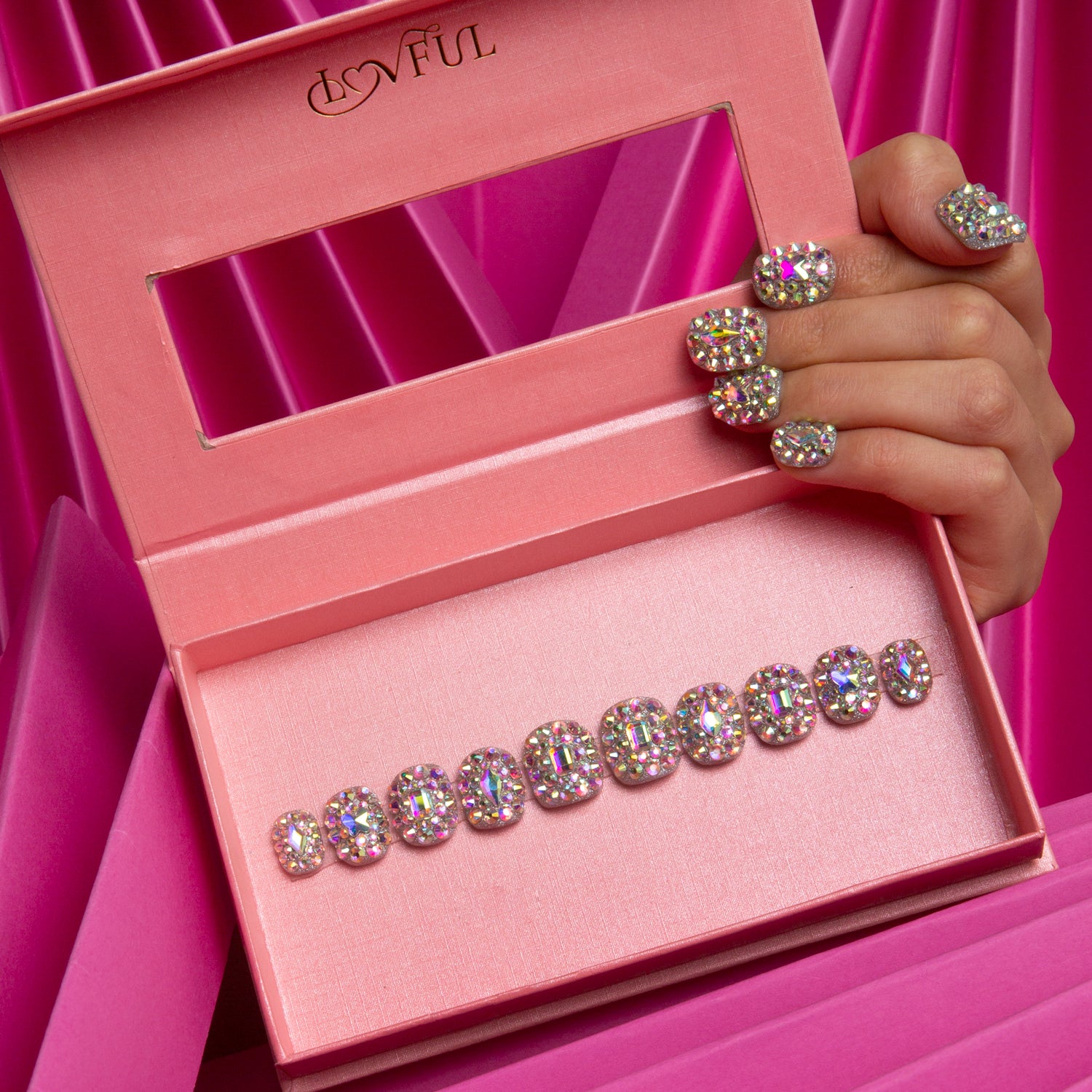 Press-on nails with crystals are the most dazzling accessory for any occasion