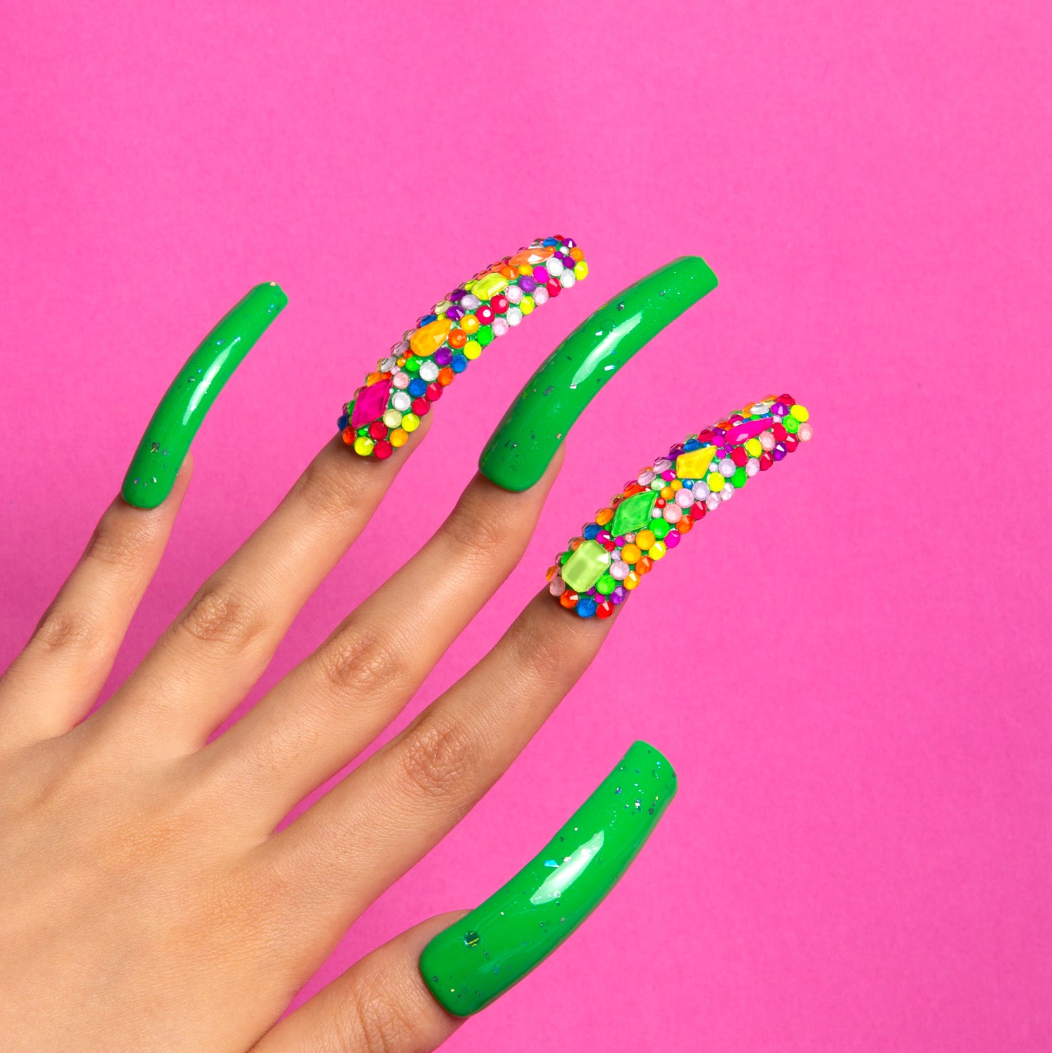 Each nail is green with sequins, like dewdrops in an enchanted forest. These are Dreamy Luxe Press-On Nails.