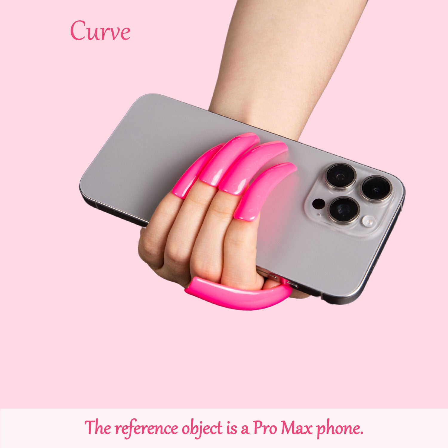 Hand with bright pink curved press-on nails holding a Pro Max phone against a light pink background. Text on the image reads 'Curve' and 'The reference object is a Pro Max phone.'